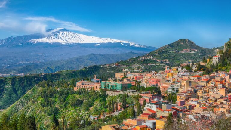 Etna volcano and Taormina town aerial panoramic view
